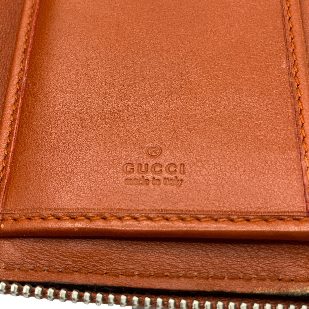 Gucci wallet made of orange monogram leather