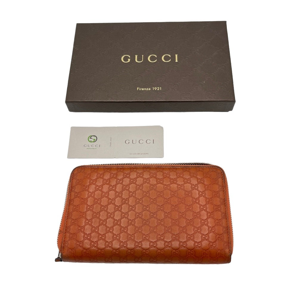 Gucci wallet made of orange monogram leather